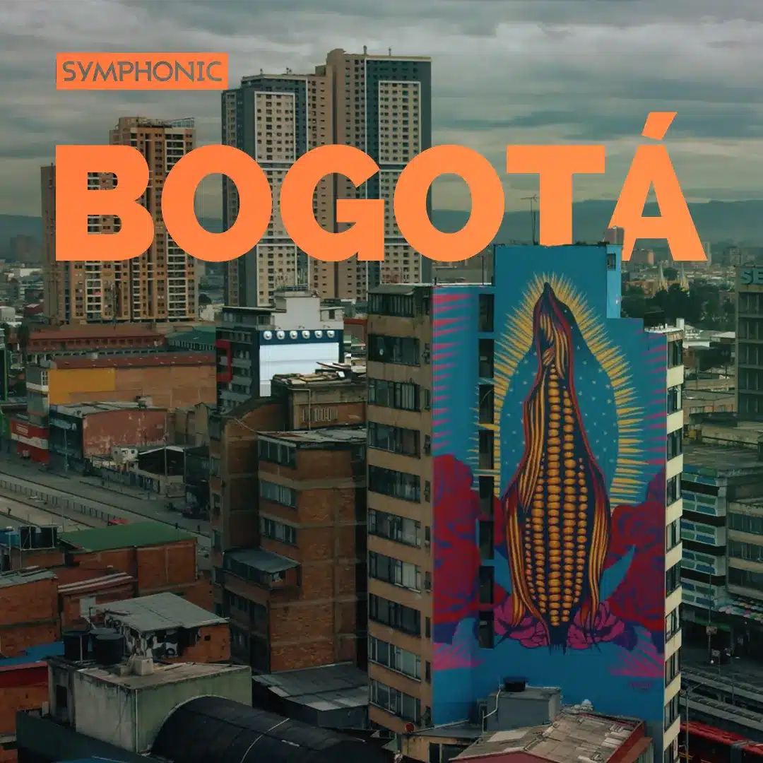 Cityscape of Bogotá with tall buildings and a colorful mural, incorporating About Symphonic themes, showcasing a stylized religious figure. The word "Bogotá" is prominently overlaid in orange text.